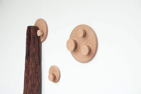 Orbit is a series of wood round hangers with simple structures