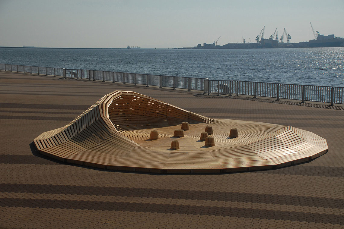 24d-studio designed Crater Lake installation is a wooden undulating platform located in the seaside park in Kobe