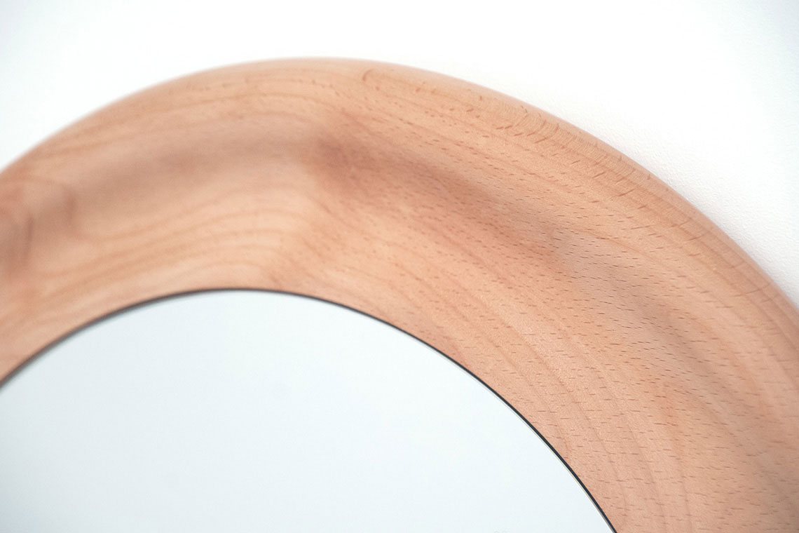 Detail photo of Large Crater Mirror carved solid beech wood frame