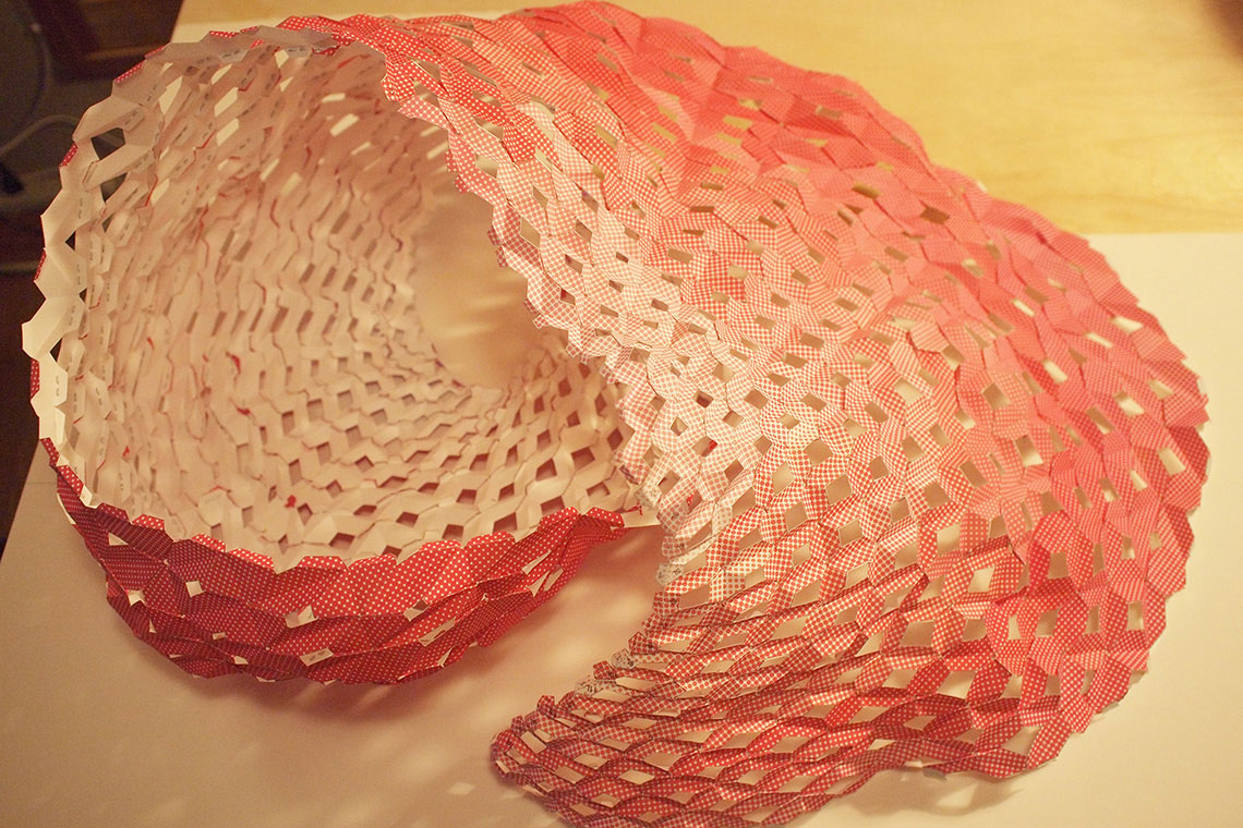 Pink Steam installation proposal inspired by Miami urban sky is composed of folded strips connected together to create a complex three dimensional volume.